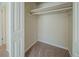 White closet with wood shelving and neutral carpeting at 3488 Brookfield Ln, Decatur, GA 30032