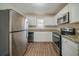 Modern kitchen with stainless steel appliances and granite countertops at 3488 Brookfield Ln, Decatur, GA 30032