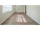 Bright living room with hardwood floors and large windows at 3488 Brookfield Ln, Decatur, GA 30032