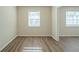 Living room featuring hardwood floors and large windows at 3488 Brookfield Ln, Decatur, GA 30032