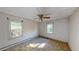 Spacious bedroom with two windows and carpet at 410 Picketts Mill Rd, Dallas, GA 30157