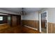 View of the dining room with chandelier and wood paneling at 410 Picketts Mill Rd, Dallas, GA 30157