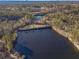 Aerial view showing two serene lakes surrounded by lush greenery at 910 Callee Dr, Loganville, GA 30052