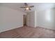 Spacious bedroom with ceiling fan and walk-in closet at 910 Callee Dr, Loganville, GA 30052