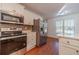 Stainless steel appliances and white shaker cabinets in kitchen at 910 Callee Dr, Loganville, GA 30052