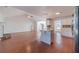 Kitchen boasts hardwood floors, island, and white cabinets at 910 Callee Dr, Loganville, GA 30052