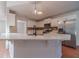 Kitchen island with white cabinets and quartz countertops at 910 Callee Dr, Loganville, GA 30052