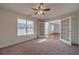 Bright office featuring carpet, ceiling fan, and French doors at 910 Callee Dr, Loganville, GA 30052