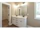 Bathroom with double sinks and a large mirror at 85 Woodfin Way, Social Circle, GA 30025