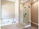 Bathroom featuring separate shower and bathtub at 85 Woodfin Way, Social Circle, GA 30025