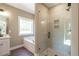 Bathroom with bathtub, shower, and modern fixtures; wood look floors at 85 Woodfin Way, Social Circle, GA 30025