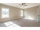 Spacious bedroom with a ceiling fan and lots of natural light at 85 Woodfin Way, Social Circle, GA 30025