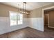 Bright dining room featuring hardwood flooring and natural light at 85 Woodfin Way, Social Circle, GA 30025