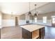 Open living space with island, fireplace and hardwood flooring at 85 Woodfin Way, Social Circle, GA 30025
