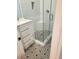 Updated bathroom with white subway tile and patterned floor at 64 Goldrush Cir, Atlanta, GA 30328