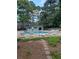 Relaxing community pool with plenty of lounge chairs at 64 Goldrush Cir, Atlanta, GA 30328