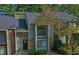 Charming townhome with a gray roof and stone accents at 64 Goldrush Cir, Atlanta, GA 30328