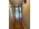 Hardwood floor hallway leading to backyard access at 64 Goldrush Cir, Atlanta, GA 30328