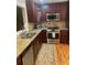 Updated kitchen with stainless steel appliances and granite countertops at 64 Goldrush Cir, Atlanta, GA 30328