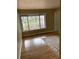Bright living room featuring hardwood floors and large window at 64 Goldrush Cir, Atlanta, GA 30328