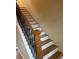 Elegant staircase with wood and wrought-iron accents at 64 Goldrush Cir, Atlanta, GA 30328