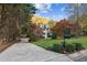 Two-story house with autumn trees and a landscaped lawn at 7470 Wynfield Dr, Cumming, GA 30040