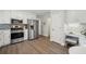 Kitchen with stainless steel appliances and white cabinets at 7470 Wynfield Dr, Cumming, GA 30040