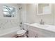 Modern bathroom with white vanity and marble shower surround at 2178 Baker Nw Ter, Atlanta, GA 30318