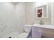 Clean bathroom with white vanity and marble shower at 2178 Baker Nw Ter, Atlanta, GA 30318