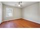Simple bedroom with wood floors and window at 2178 Baker Nw Ter, Atlanta, GA 30318