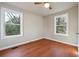 Well-lit bedroom with wood floors and two large windows at 2178 Baker Nw Ter, Atlanta, GA 30318