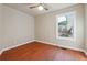 Bright bedroom with wood floors and large window at 2178 Baker Nw Ter, Atlanta, GA 30318