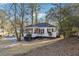 White house with a screened porch and yard, side view at 2178 Baker Nw Ter, Atlanta, GA 30318