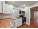 Modern kitchen with white cabinets, butcher block counters at 2178 Baker Nw Ter, Atlanta, GA 30318