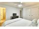 Bright bedroom with white walls, ceiling fan, and a walk in shower in the ensuite bathroom at 3545 Fairway Dr, Atlanta, GA 30337