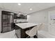 Modern basement kitchen featuring dark cabinetry and a large island at 3494 Old Suttons Way, Marietta, GA 30062