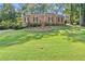 Brick ranch house with a well-manicured lawn at 3494 Old Suttons Way, Marietta, GA 30062