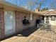 Outdoor back deck with an exterior shot of furniture and a grill, and a partially screened sunroom at 747 Dogwood Cir, Norcross, GA 30071