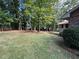Large, well-maintained backyard with lush green grass and mature trees, creating a serene outdoor space at 747 Dogwood Cir, Norcross, GA 30071