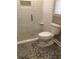 Stylish bathroom showcasing decorative tile flooring and a modern toilet at 747 Dogwood Cir, Norcross, GA 30071