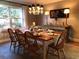 Bright dining area with large windows, a stylish chandelier, and seating for six at 747 Dogwood Cir, Norcross, GA 30071