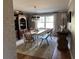 Dining room featuring an elegant chandelier, a large window, and stylish decor at 747 Dogwood Cir, Norcross, GA 30071