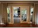 Bright sun room with large windows and French doors leading to an outdoor space at 747 Dogwood Cir, Norcross, GA 30071