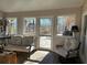 Inviting sun room with comfortable seating, large windows with outdoor views, and a bright atmosphere at 747 Dogwood Cir, Norcross, GA 30071