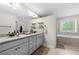 Double vanity bathroom with soaking tub and separate shower at 2647 Old Snapping Shoals Rd, Mcdonough, GA 30252
