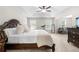 Spacious primary bedroom with a large bed and sitting area at 2647 Old Snapping Shoals Rd, Mcdonough, GA 30252