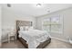 Bright bedroom with plush carpet and large window at 2647 Old Snapping Shoals Rd, Mcdonough, GA 30252