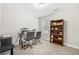 Home office with a desk, two chairs, and built-in shelving at 2647 Old Snapping Shoals Rd, Mcdonough, GA 30252