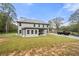 Two-story house back view with covered patio and large backyard at 2647 Old Snapping Shoals Rd, Mcdonough, GA 30252