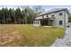 Two-story house back view with covered patio and large backyard at 2647 Old Snapping Shoals Rd, Mcdonough, GA 30252